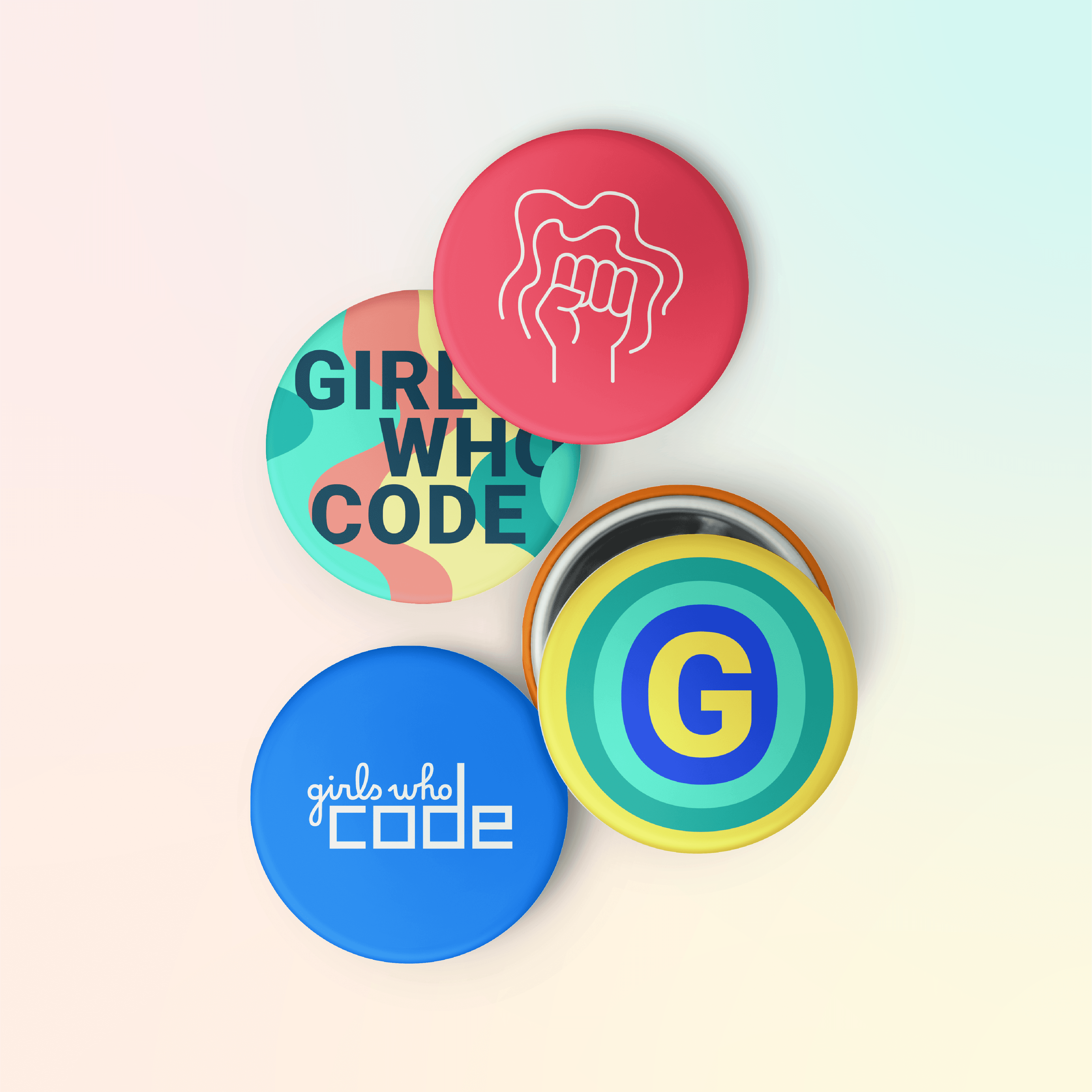 Four round buttons on a pastel gradient background. The top left button is red with a hand showing the pinky, white text. The others say "GIRLS WHO CODE" on colorful background, "G" with concentric circles, "girls who code" in white on blue, respectively.