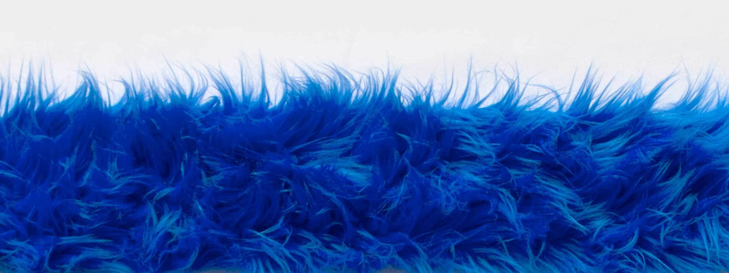 A strip of vibrant blue, fluffy fur stretches across the center of the image against a white background. The fur appears soft, wavy, and slightly blended with shades of lighter and darker blue, giving it a rich, textured look.