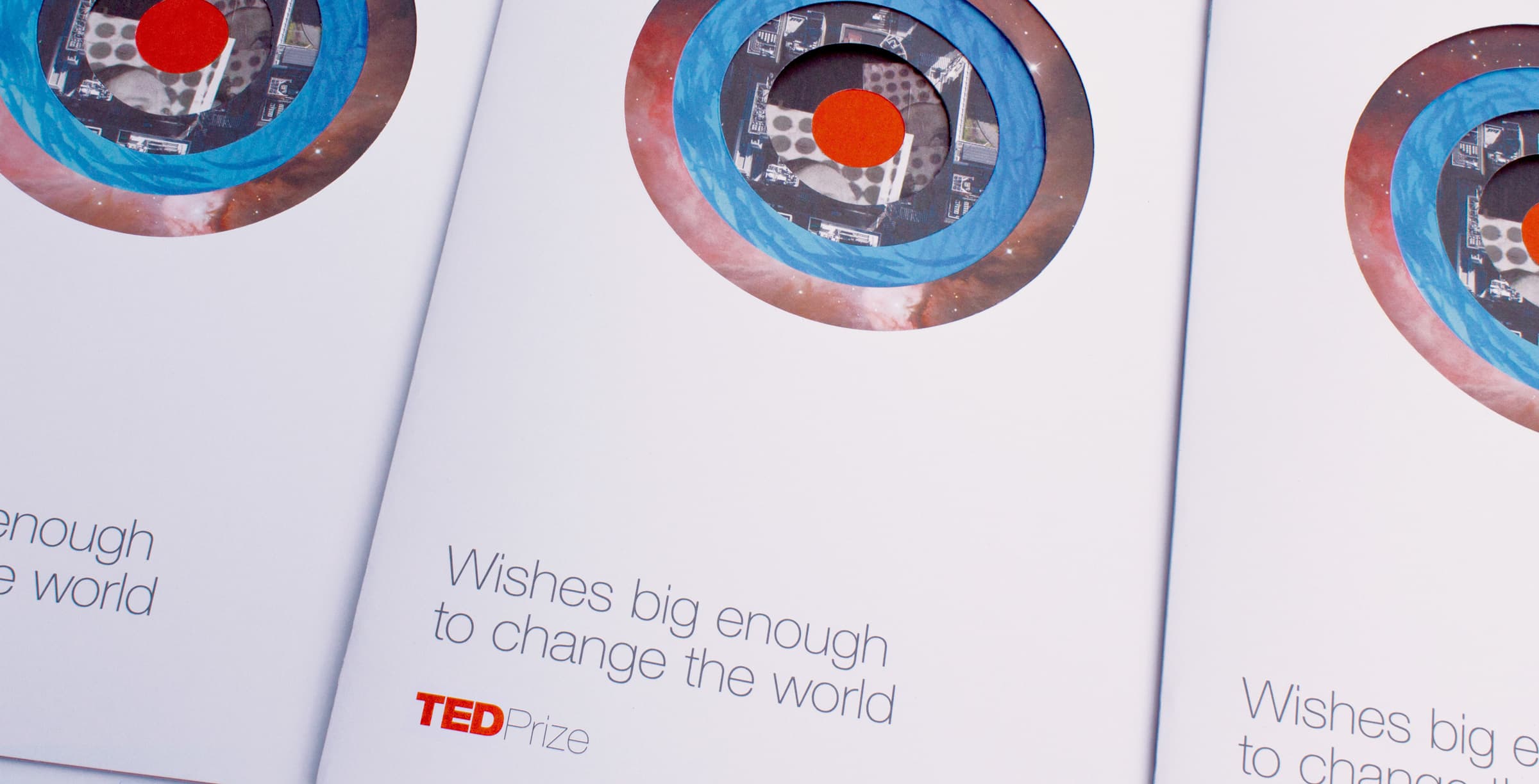 Three brochures are laid out with a graphic of a circular design resembling a telescope view on the cover. Below the graphic, the text reads, "Wishes big enough to change the world." The TED Prize logo is displayed at the bottom.