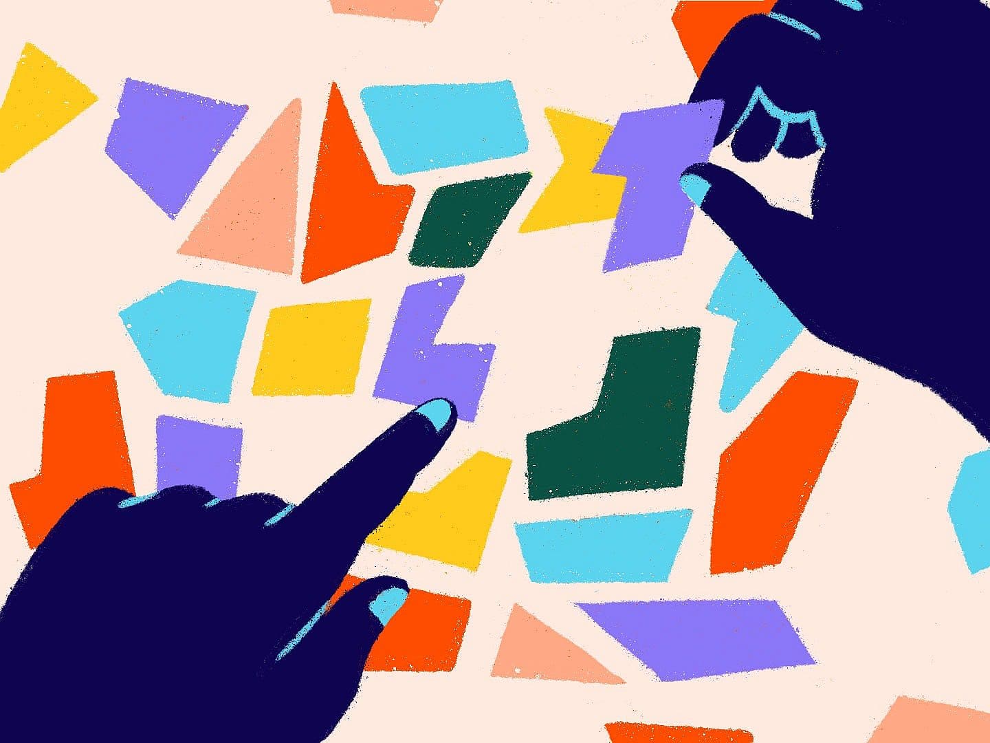 Two dark blue hands are arranging colorful, irregularly shaped paper pieces on a light background. One hand is pointing, while the other holds a purple piece, suggesting organization or creative activity.