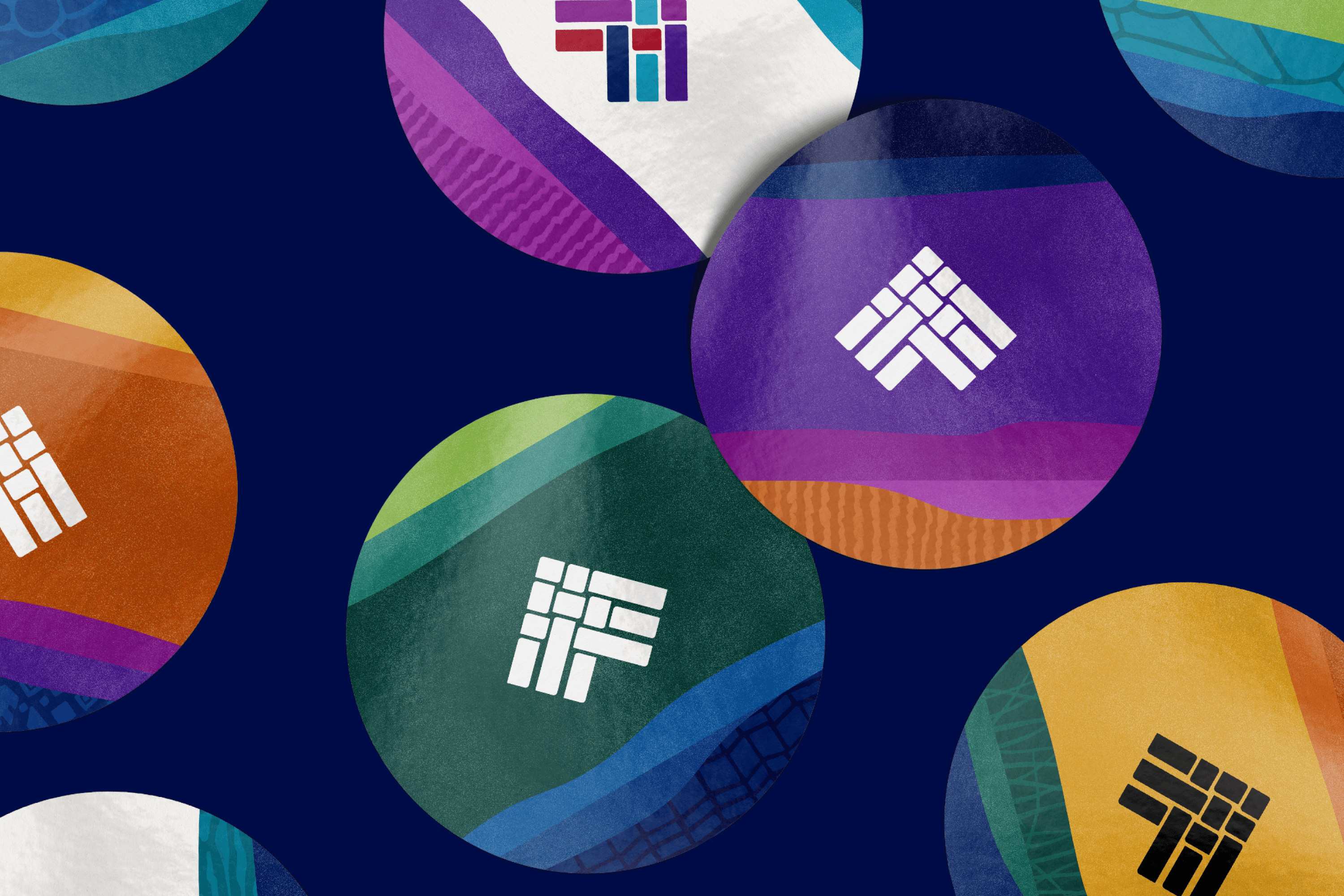 Colorful circular stickers on a dark background, each featuring a geometric logo composed of white shapes. The stickers vary in colors like orange, purple, green, and yellow, with textured gradient patterns surrounding the logos.