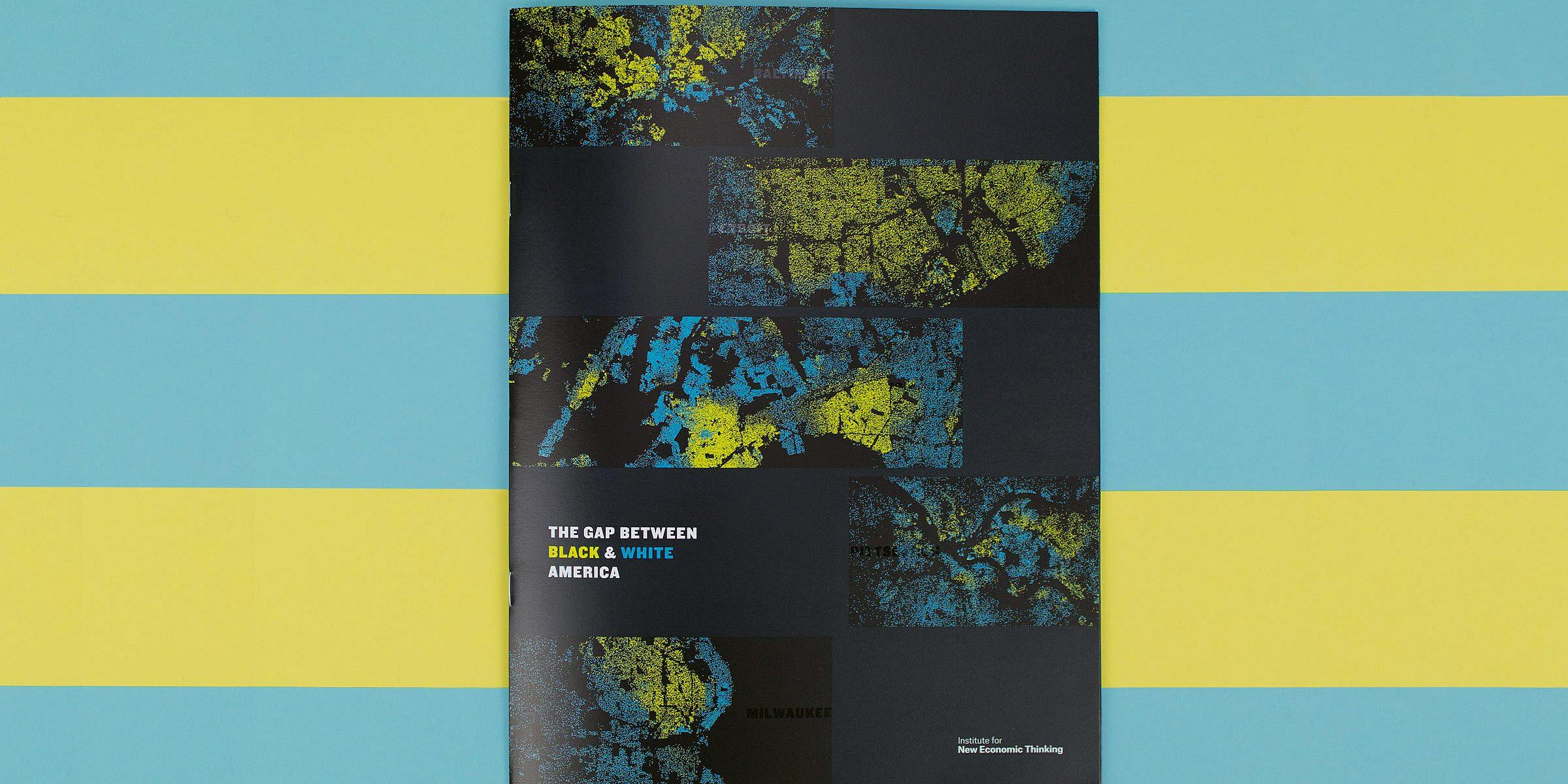 A brochure placed on a teal and yellow background displays a cover featuring a mosaic of abstract artworks in blue, yellow, and black. The title reads "The Gap Between Black & White America.