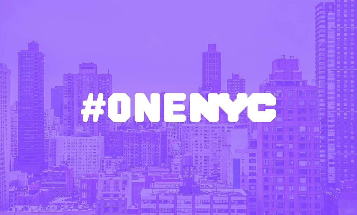 A cityscape of New York City is shown with various tall buildings against a purple-colored sky. The hashtag "#ONENYC" is prominently displayed in bold, white letters across the center of the image.