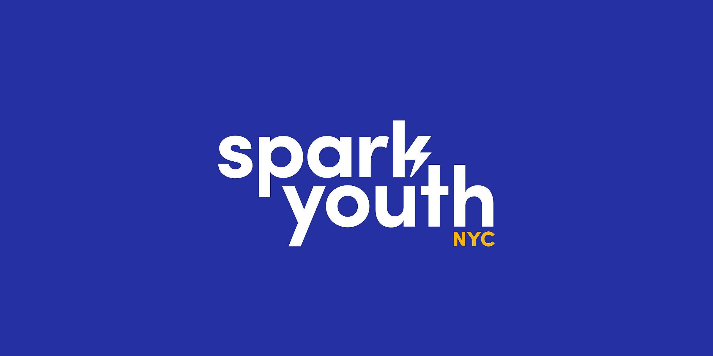 A blue background with the text "spark youth NYC" written in bold white and yellow letters. "spark" and "youth" are stacked on top of each other with "NYC" in yellow at the bottom right. The letter "k" in "spark" is stylized with a lightning bolt shape.