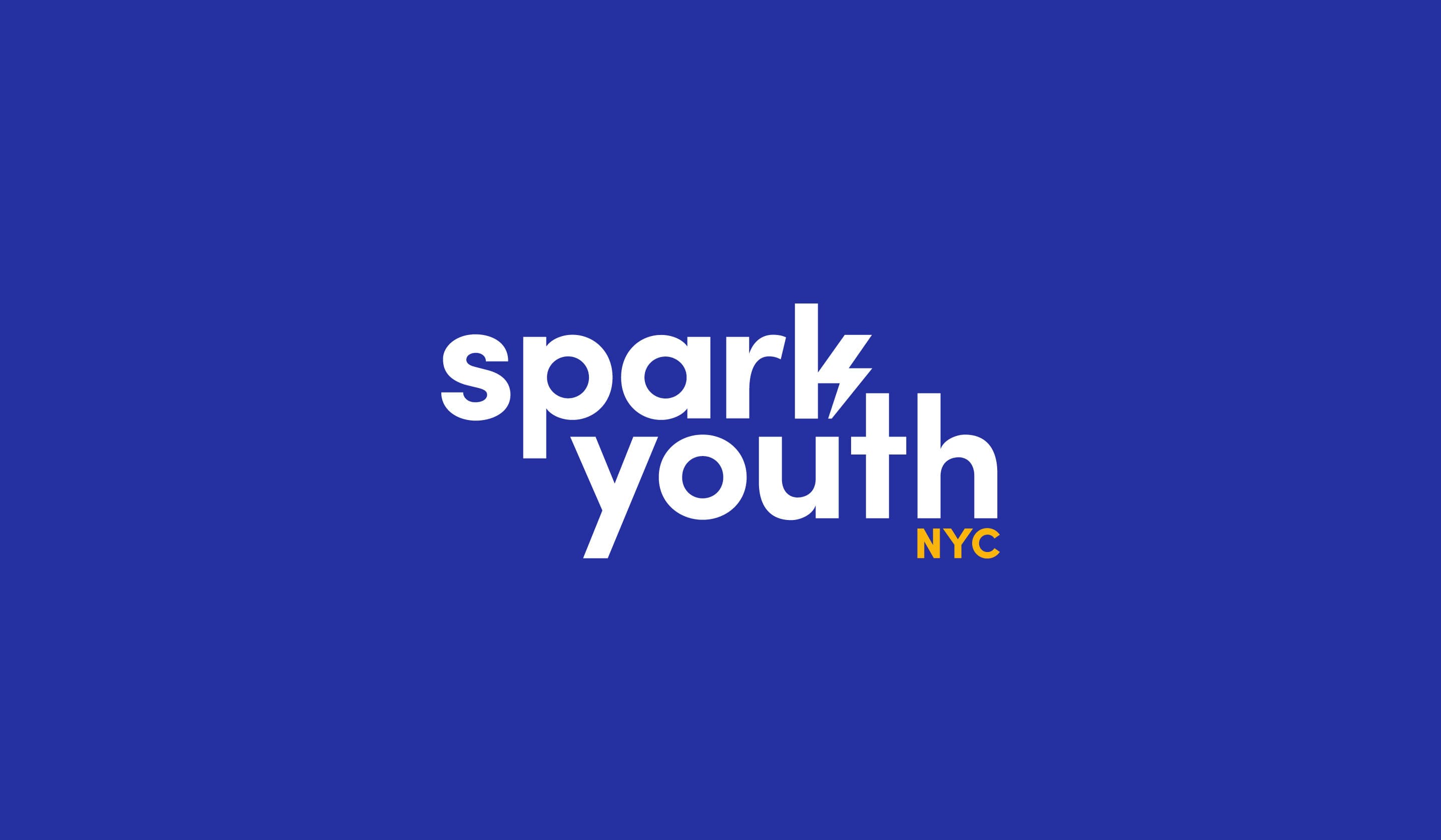 A blue background with the text "spark youth NYC" written in bold white and yellow letters. "spark" and "youth" are stacked on top of each other with "NYC" in yellow at the bottom right. The letter "k" in "spark" is stylized with a lightning bolt shape.