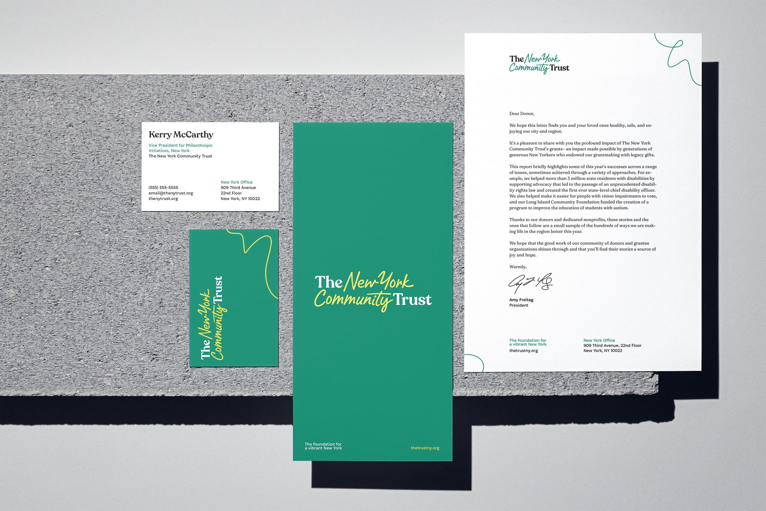 A set of branded stationary including a business card, brochure, letterhead, and envelope for "The New York Community Trust". The color scheme consists of green and white with yellow accents and elegant typography.