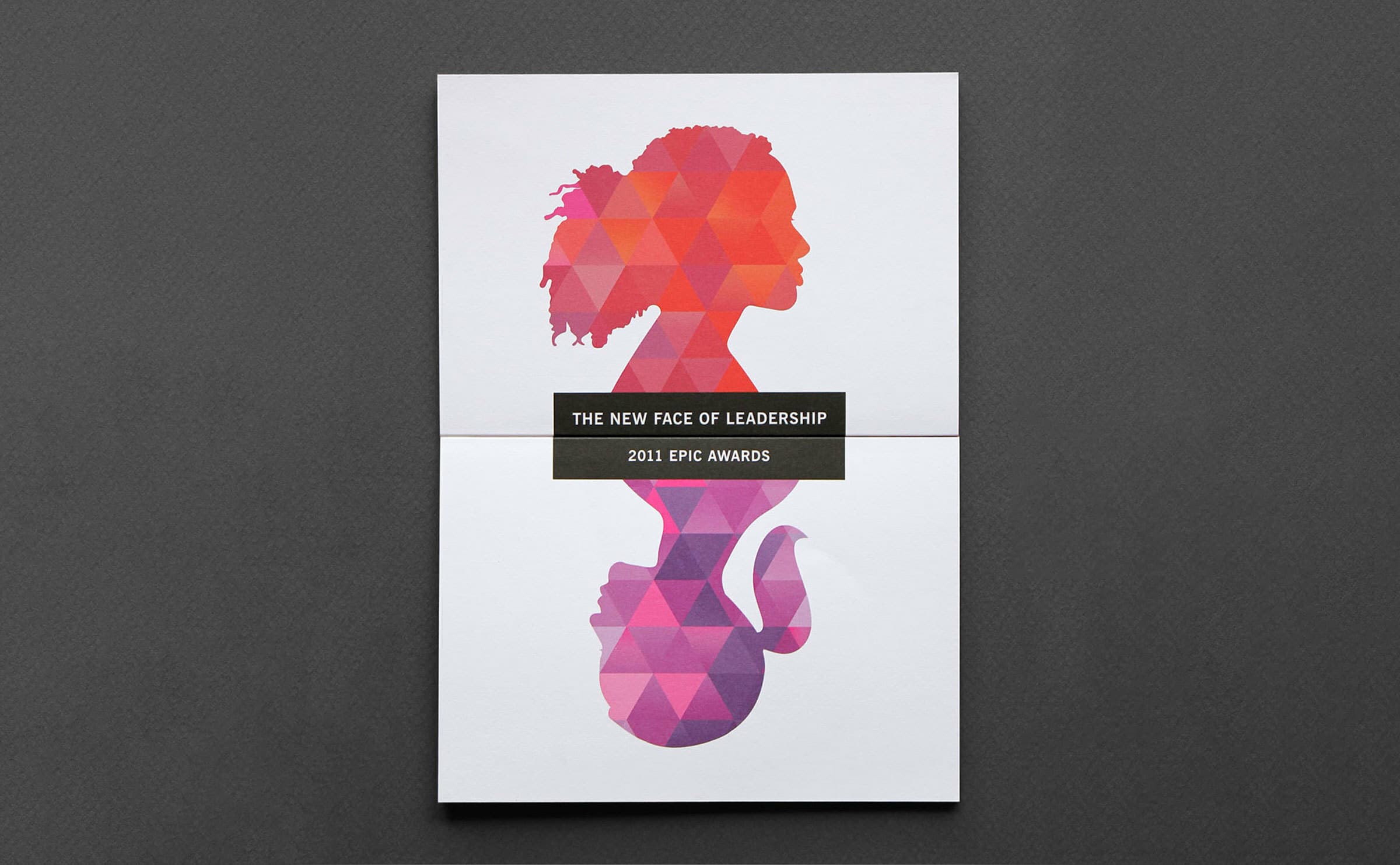 An abstract illustration of a woman's silhouette featuring a geometric pink and purple pattern. The text "THE NEW FACE OF LEADERSHIP" and "2011 EPIC AWARDS" is centered horizontally across the image on a white background.